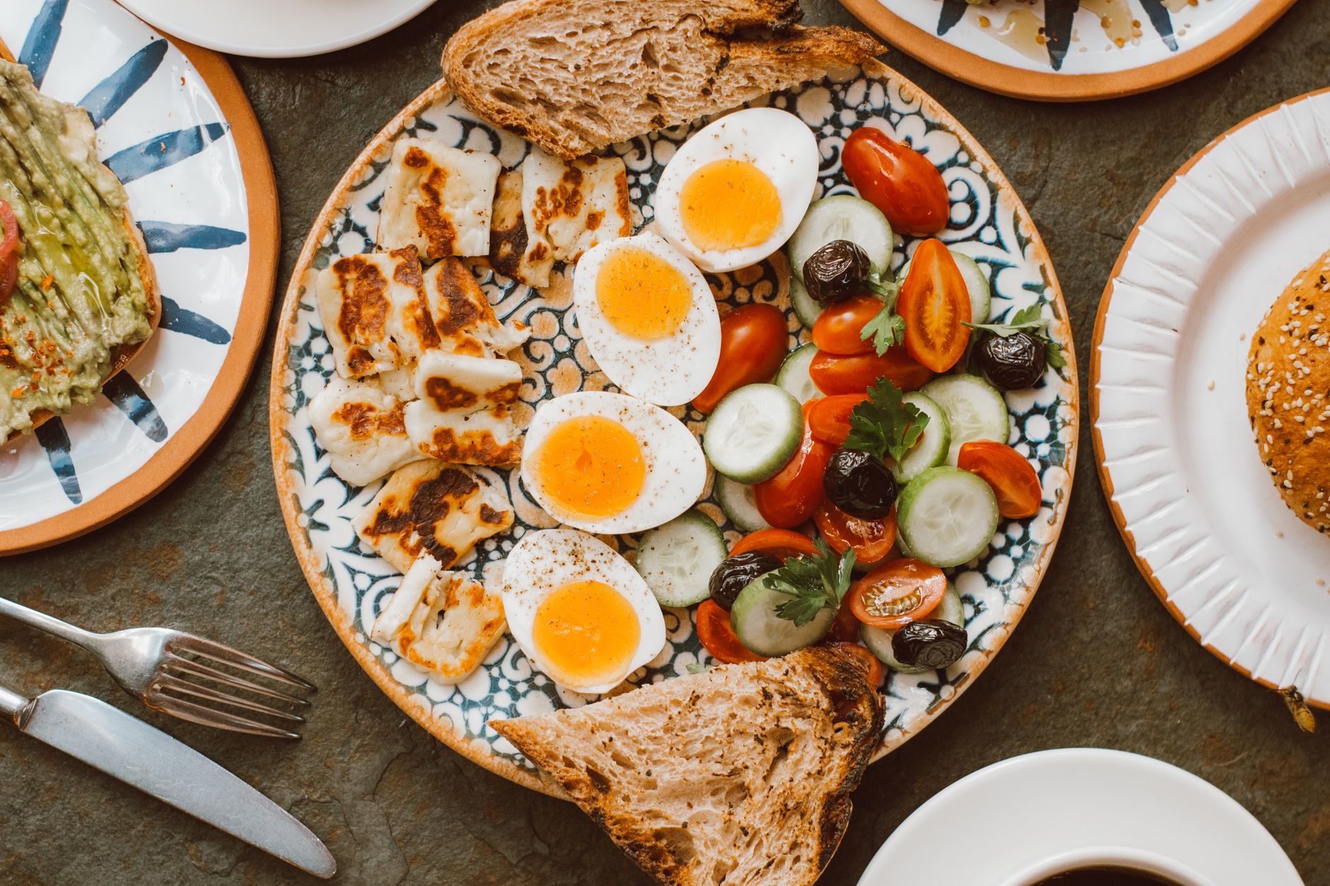 Mediterranean breakfast with boiled eggs, grilled halloumi, and fresh vegetables
