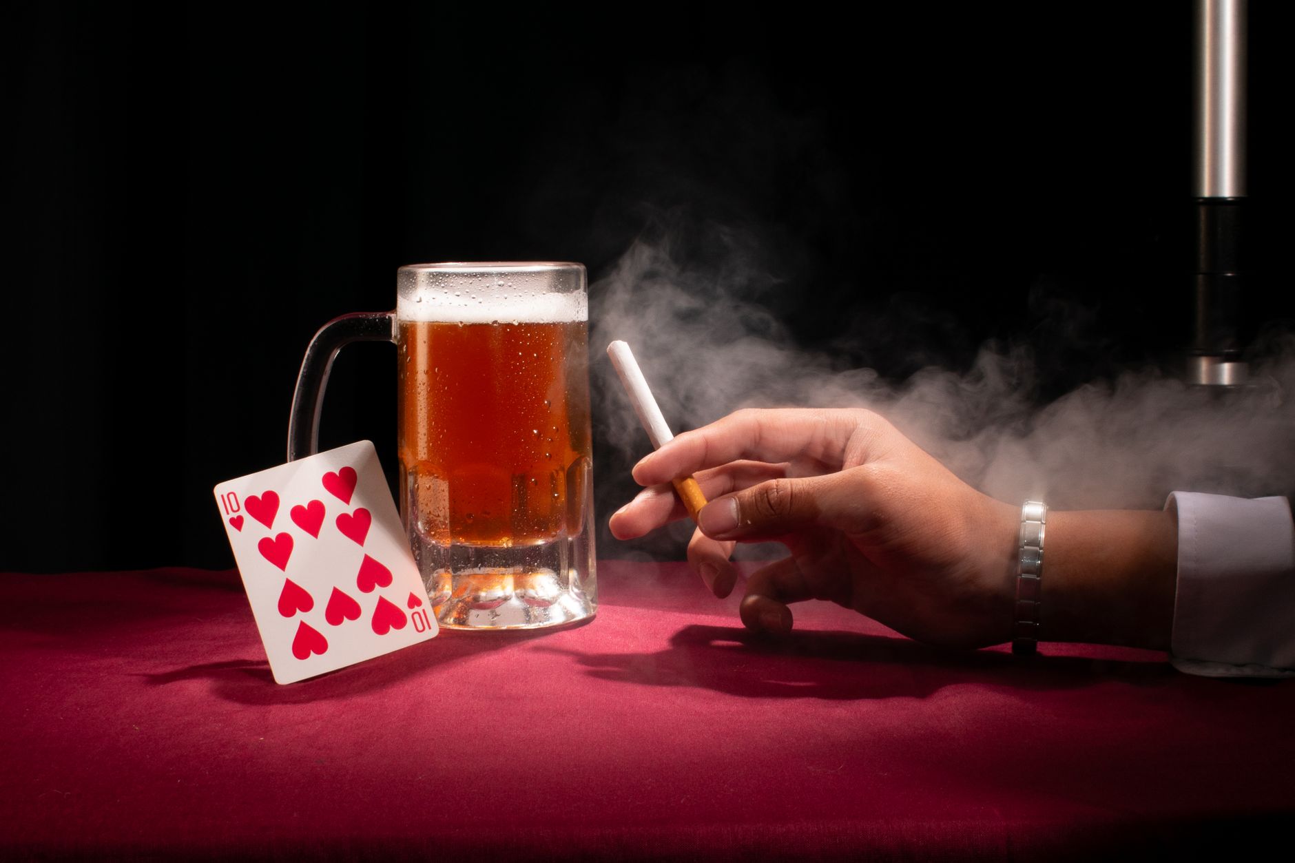 Hand holding a cigarette illustrating the health risks of smoking